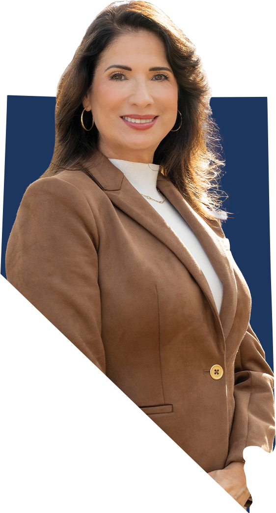 Adriana Guzmán Fralick smiling and wearing a brown jacket